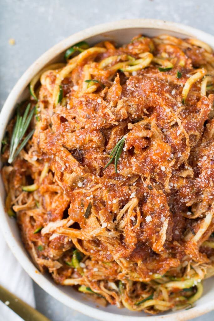 Rosemary Chicken Sauce in a white bowl over zucchini noodles.