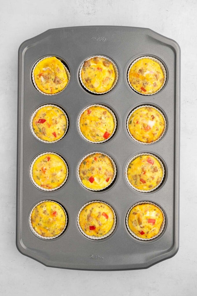 12 sausage egg muffin cups in a muffin pan. 