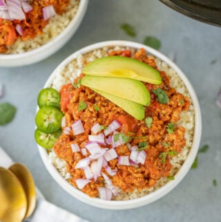 Paleo Turkey Chili in a grey background with a crockpot off to the side