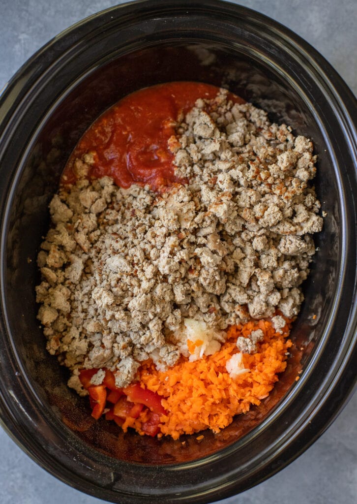 Turkey chili ingredients in a crockpot before being stirred together