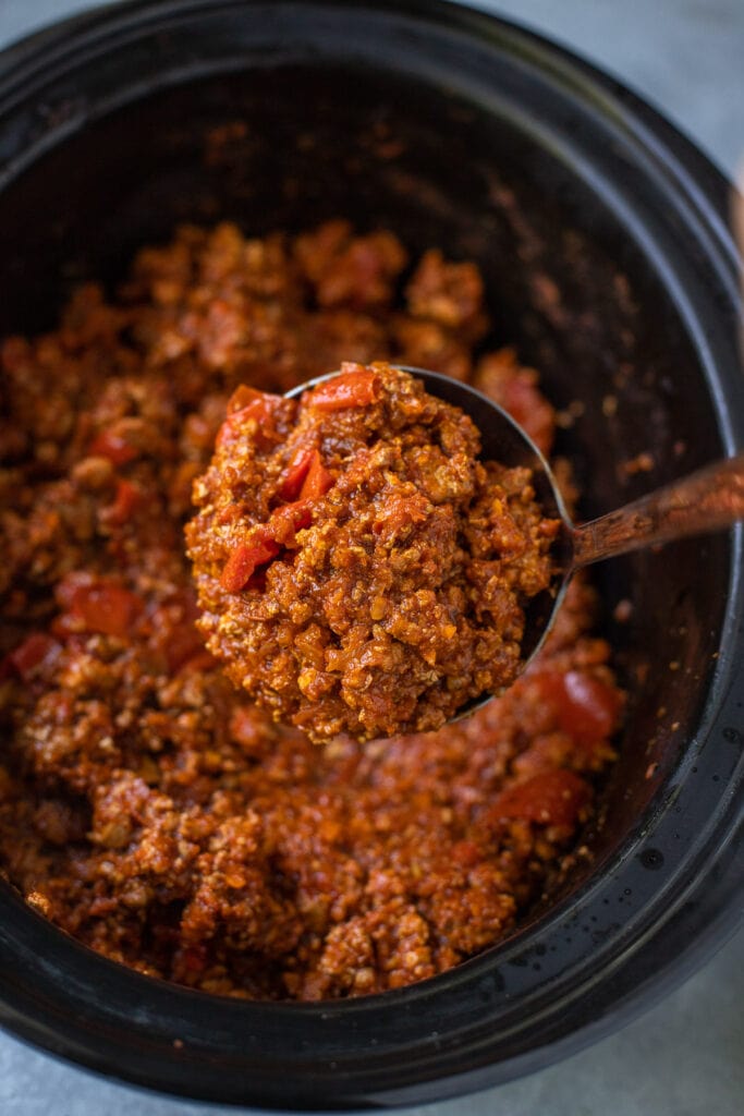 a ladel taking a scoop out of healthy turkey chili