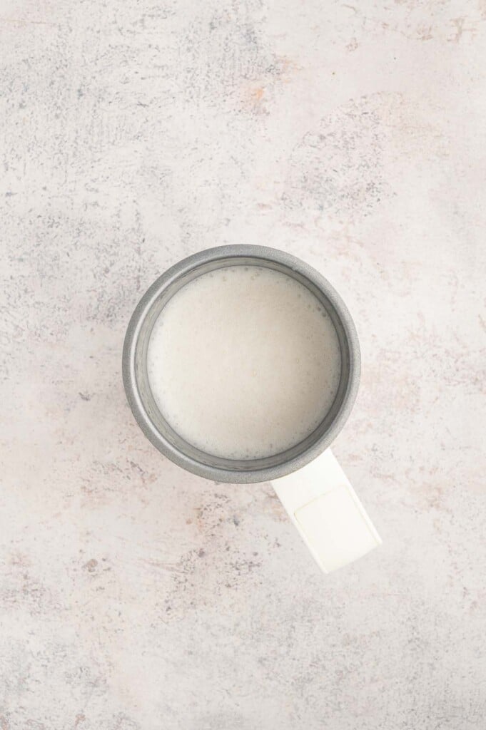 Frothed milk in a mug.