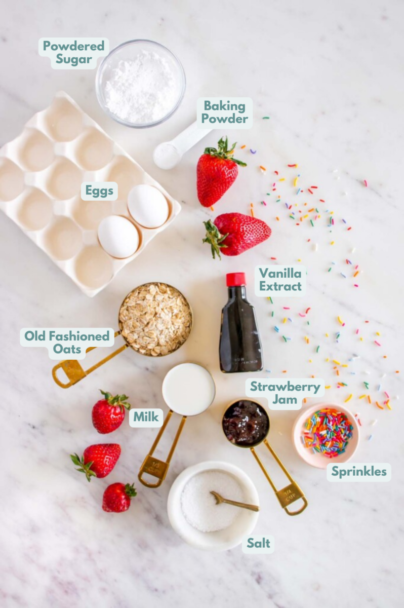 Ingredients for baked oats on a white background: old fashioned rolled oats, salt, baking powder, milk, eggs, vanilla extract, strawberry jam, powdered sugar, sprinkles