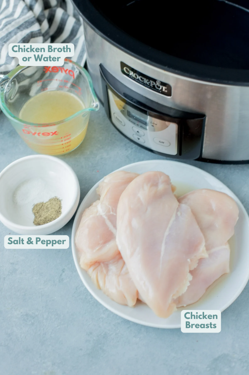 Ingredients for slow cooker shredded chicken breast in small white bowls on a grey background