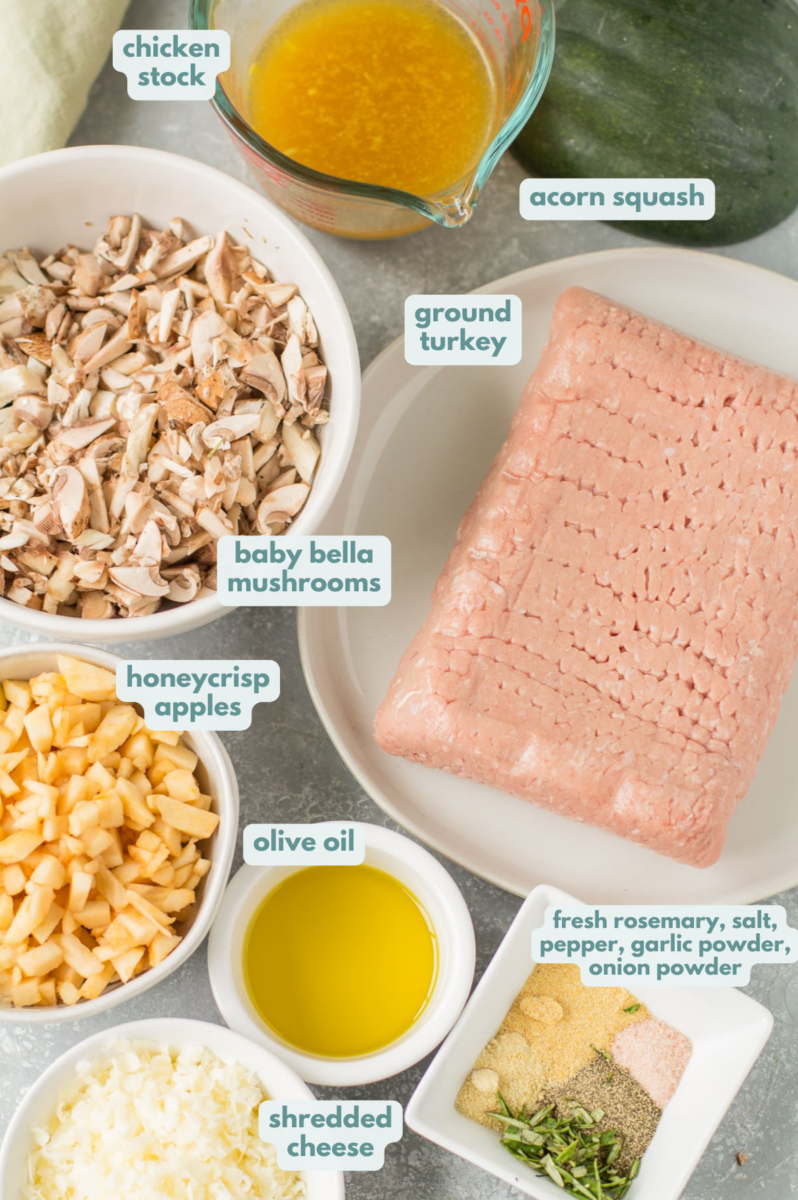Ingredients for stuffed acorn squash laid out in bowls on a grey background